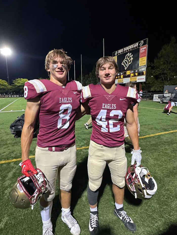 Jake and Ben Uhlenhake pose together following a Bishop Watterson football game.